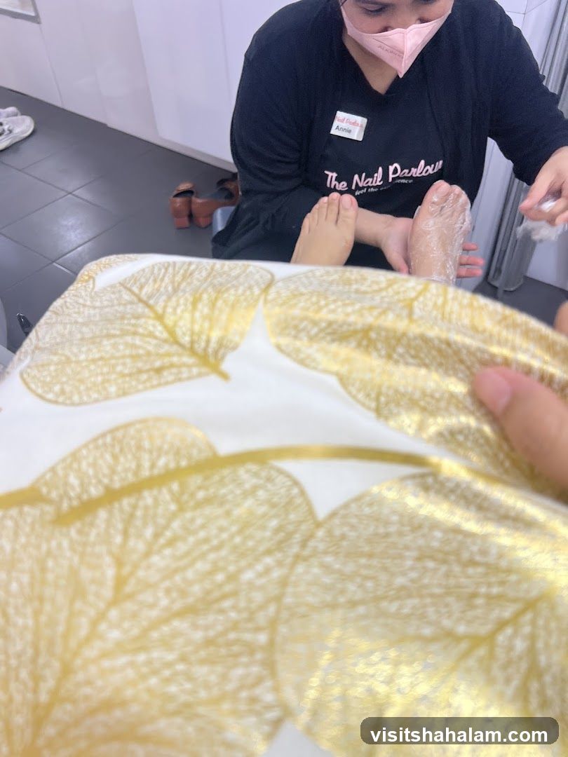Nail Technician Performing Pedicure