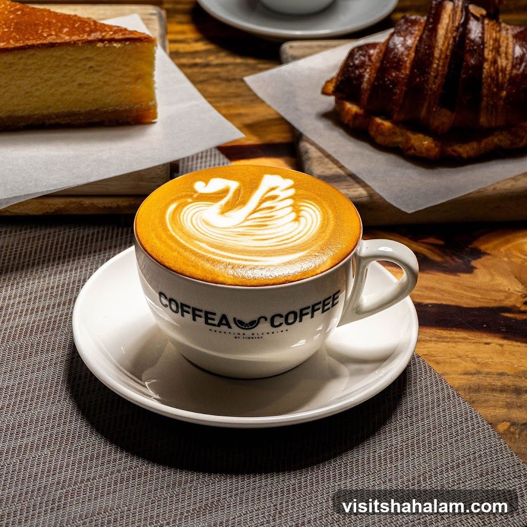 Coffee with Latte Art and Pastries