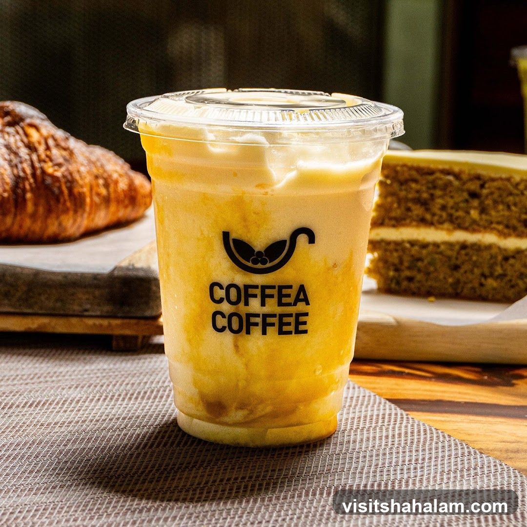 Iced Coffee Drink with Croissant and Cake