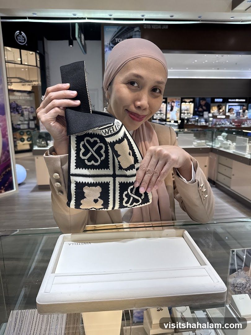 Woman holding a patterned bag in a jewelry store