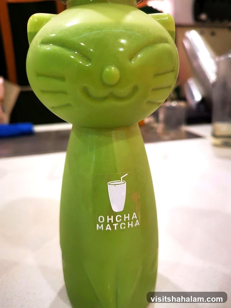 Green Cat-Shaped Bottle with Logo