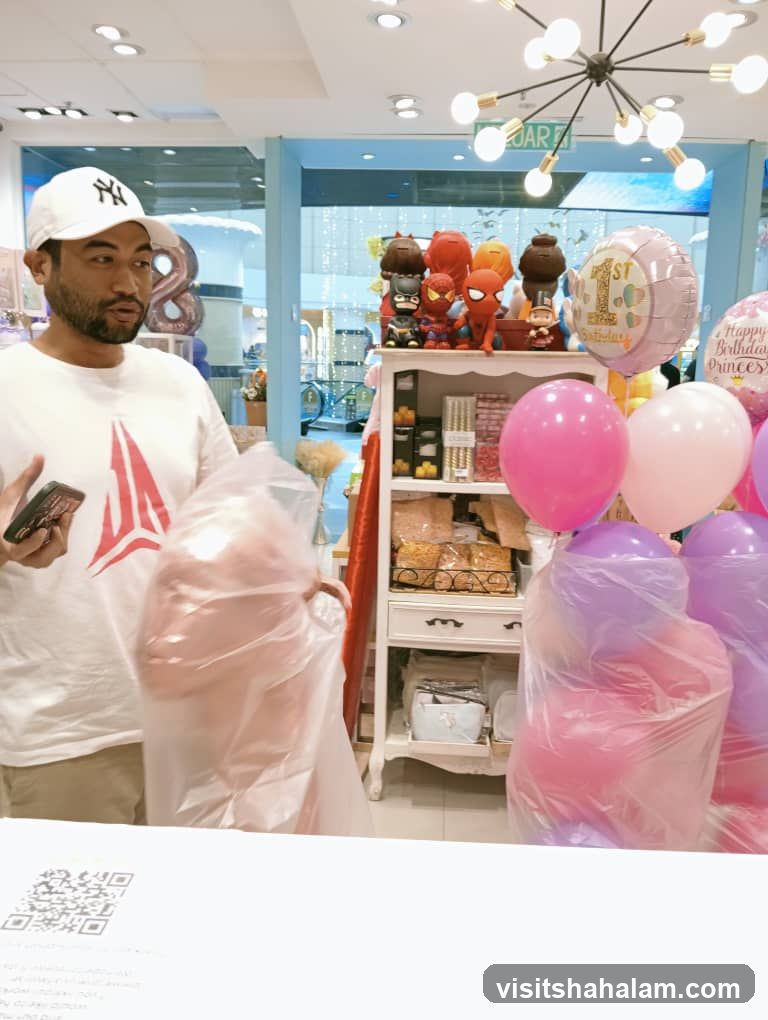 Man holding balloons in a party supply store