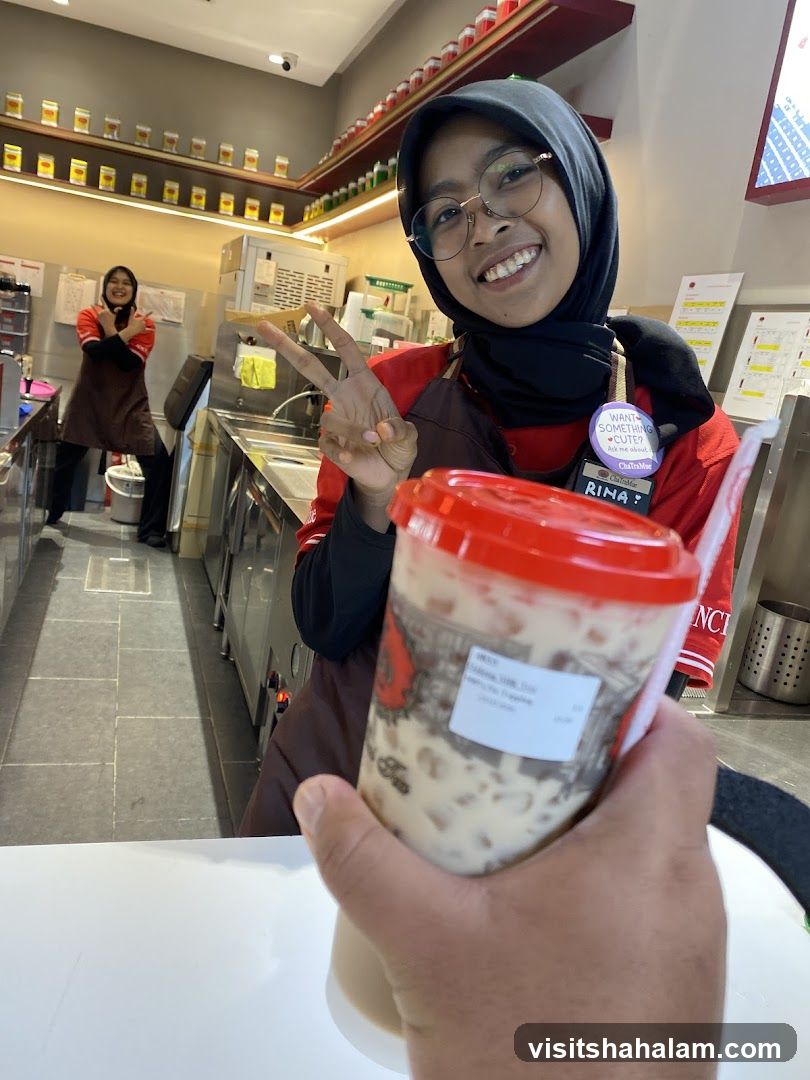 Staff holding a drink