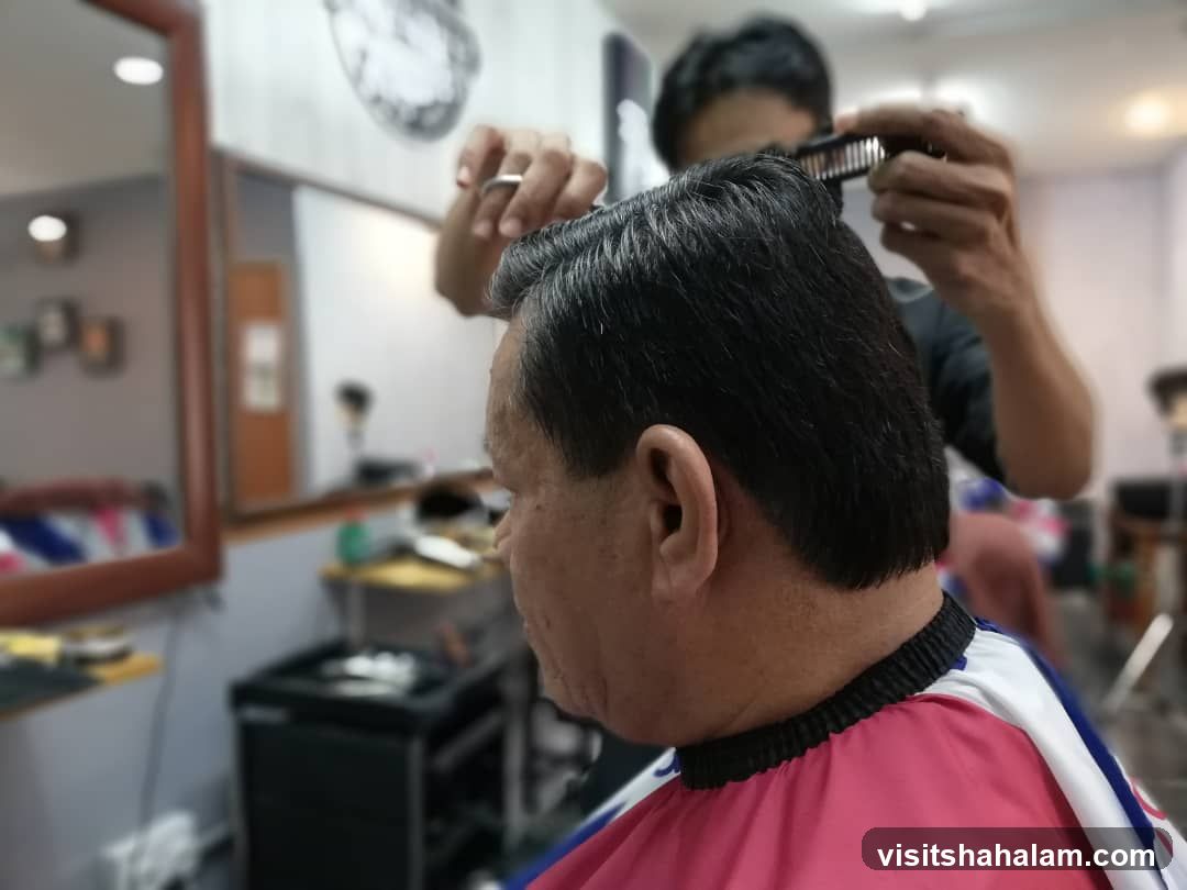 Barber cutting hair