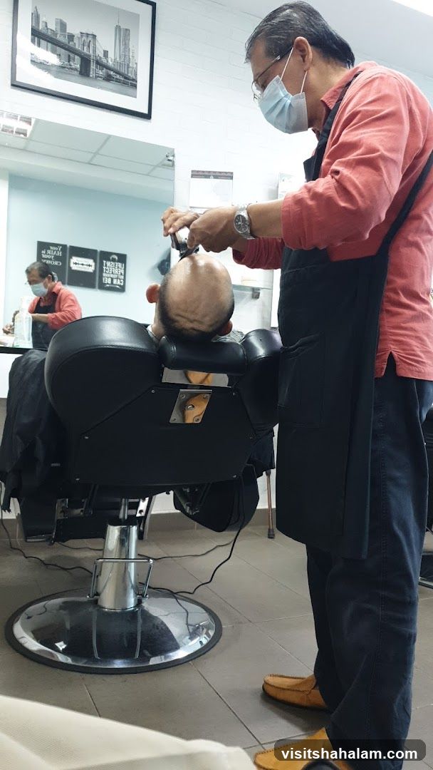 Barber shaving a client
