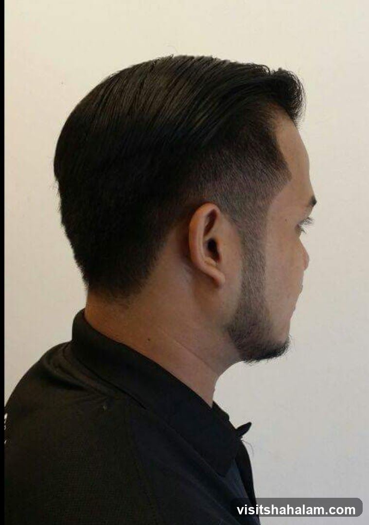 Man with a fade haircut and goatee