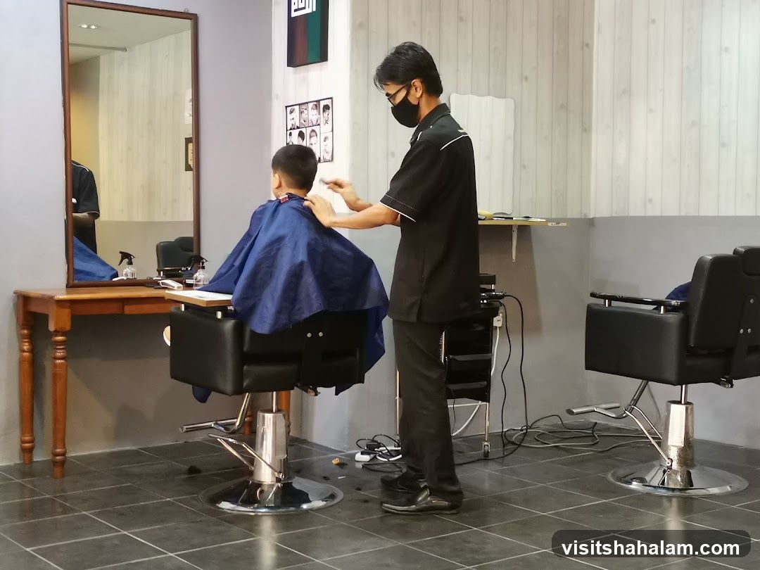 Barber cutting a boy's hair