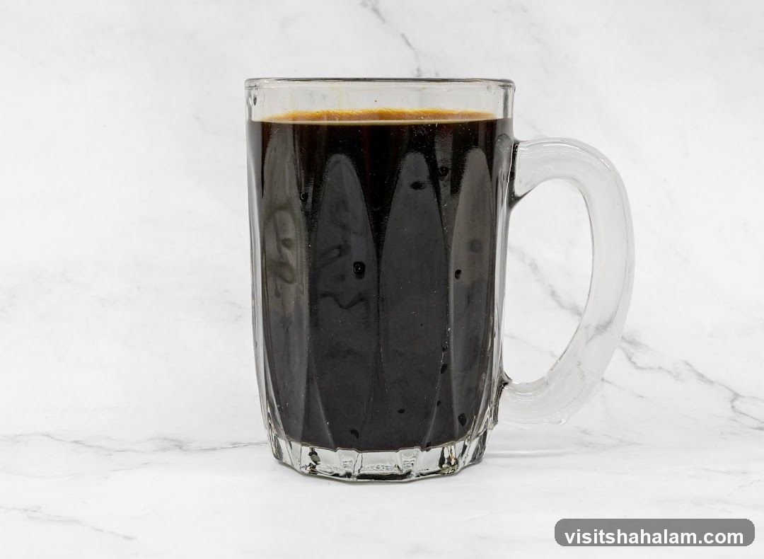 Dark Beverage in a Glass Mug