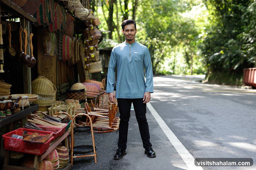 Man Posing in Front of a Handicraft Stall