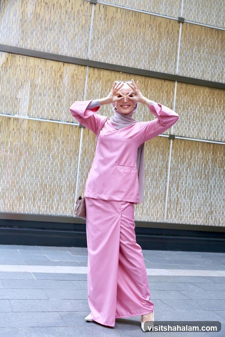 Woman in Pink Outfit Posing