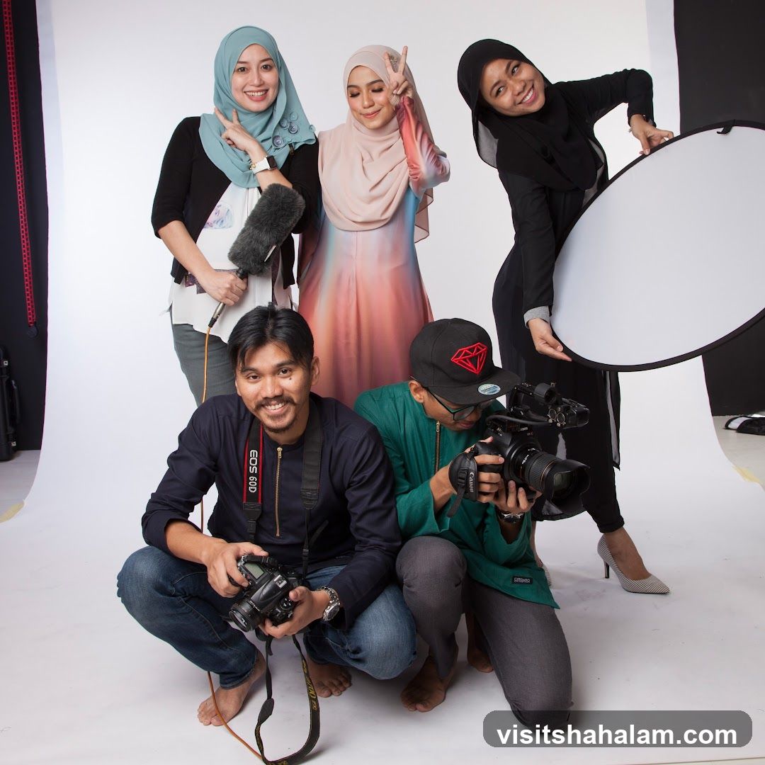 Photography team posing with equipment