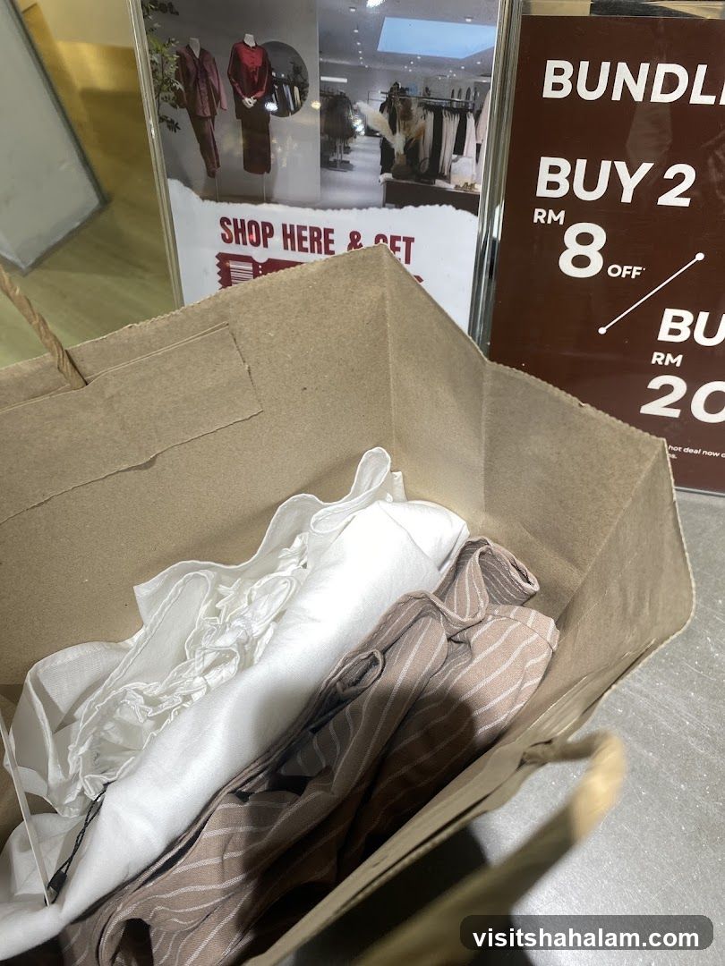 Shopping Bag with Clothing and Sale Signs