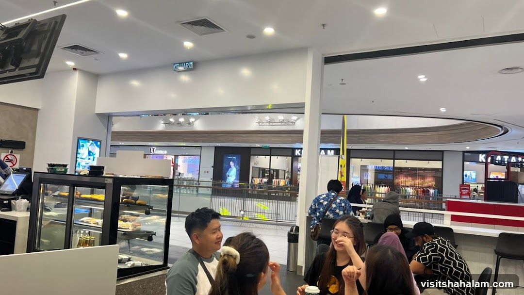 People sitting at tables in a cafe