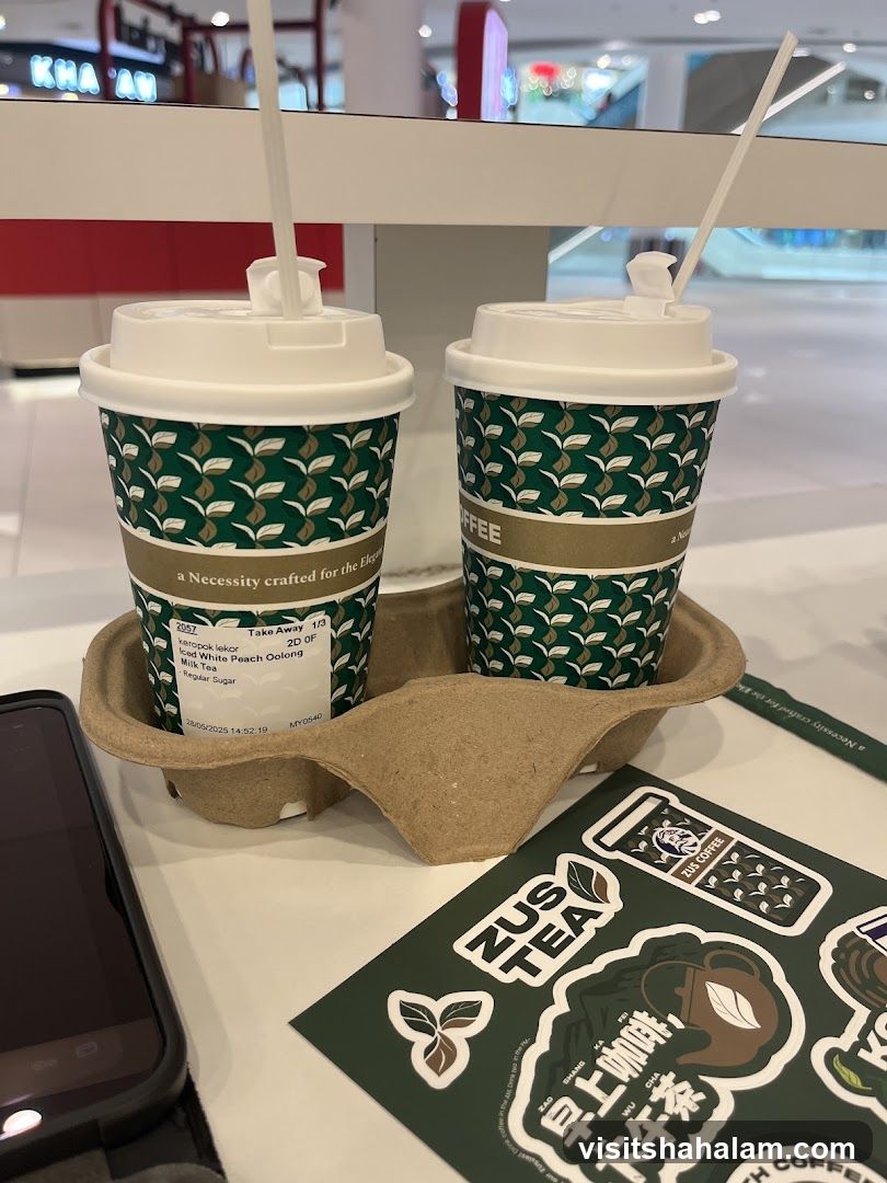 Two takeaway drinks and stickers