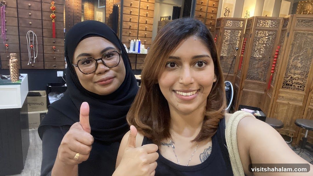 Two Women Giving Thumbs Up