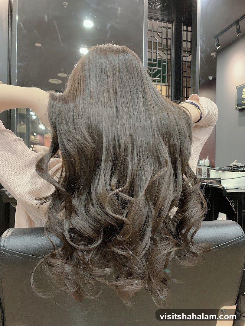 Woman with long, wavy, dark brown hair