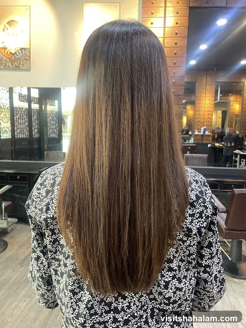 Woman with long brown hair in salon