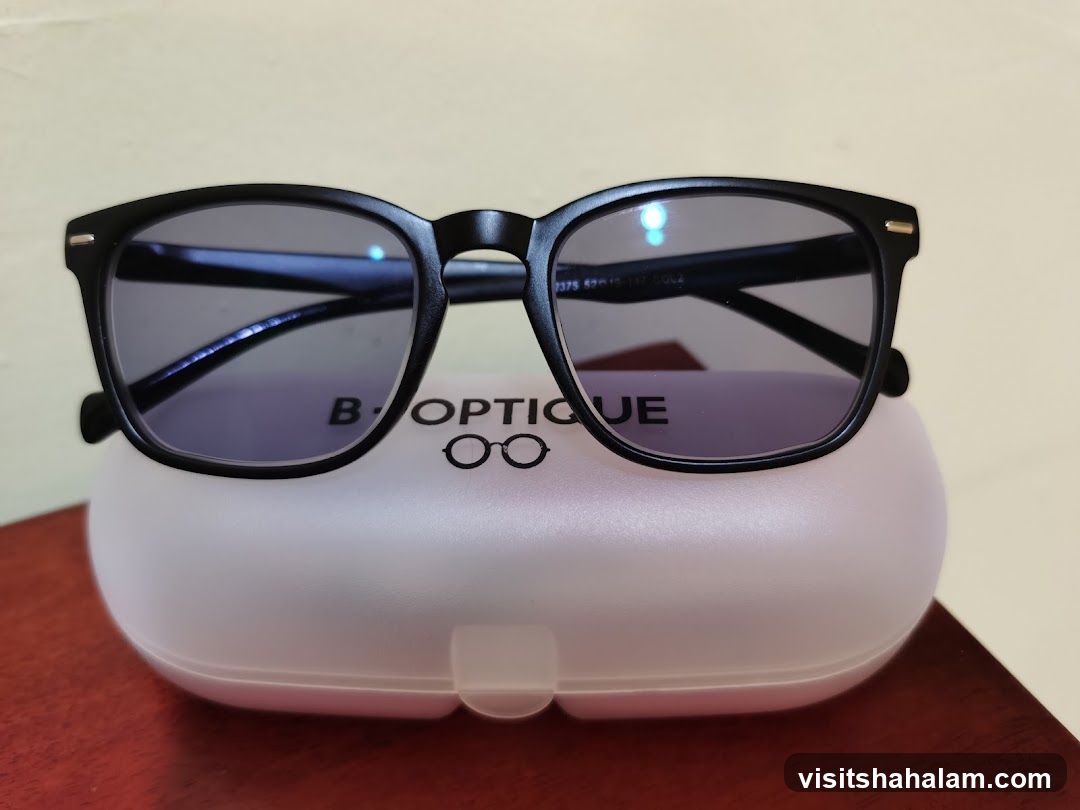 Black Eyeglasses on a Case
