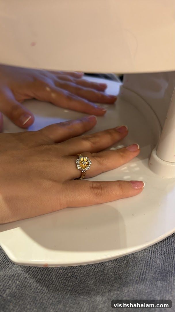 Hands under a UV nail lamp
