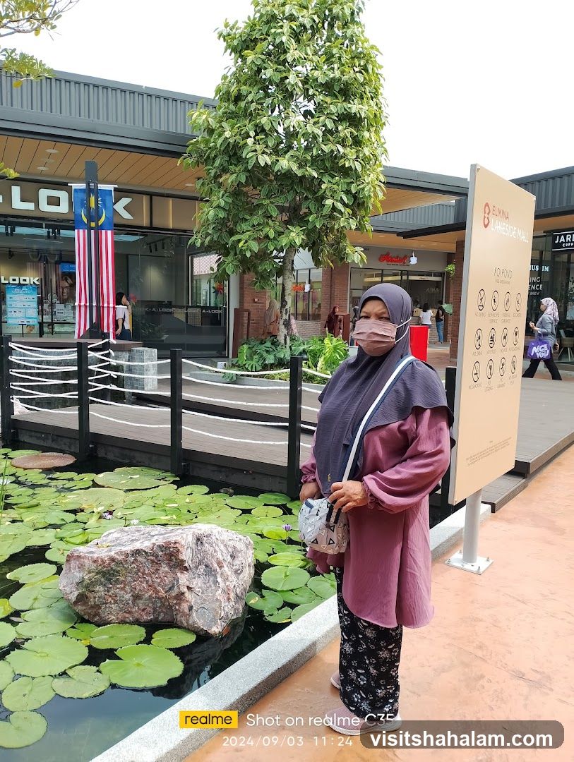Woman in a mall with a pond