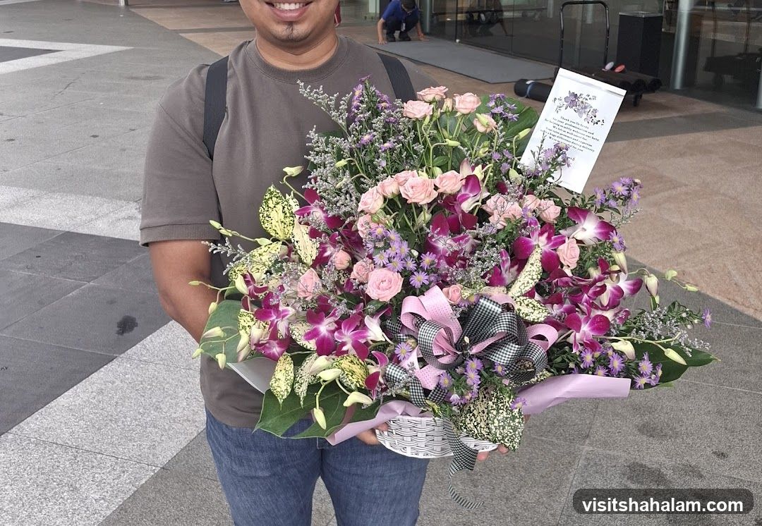 Man Holding a Flower Arrangement