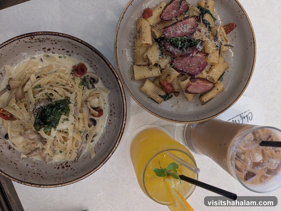 Two pasta dishes and drinks