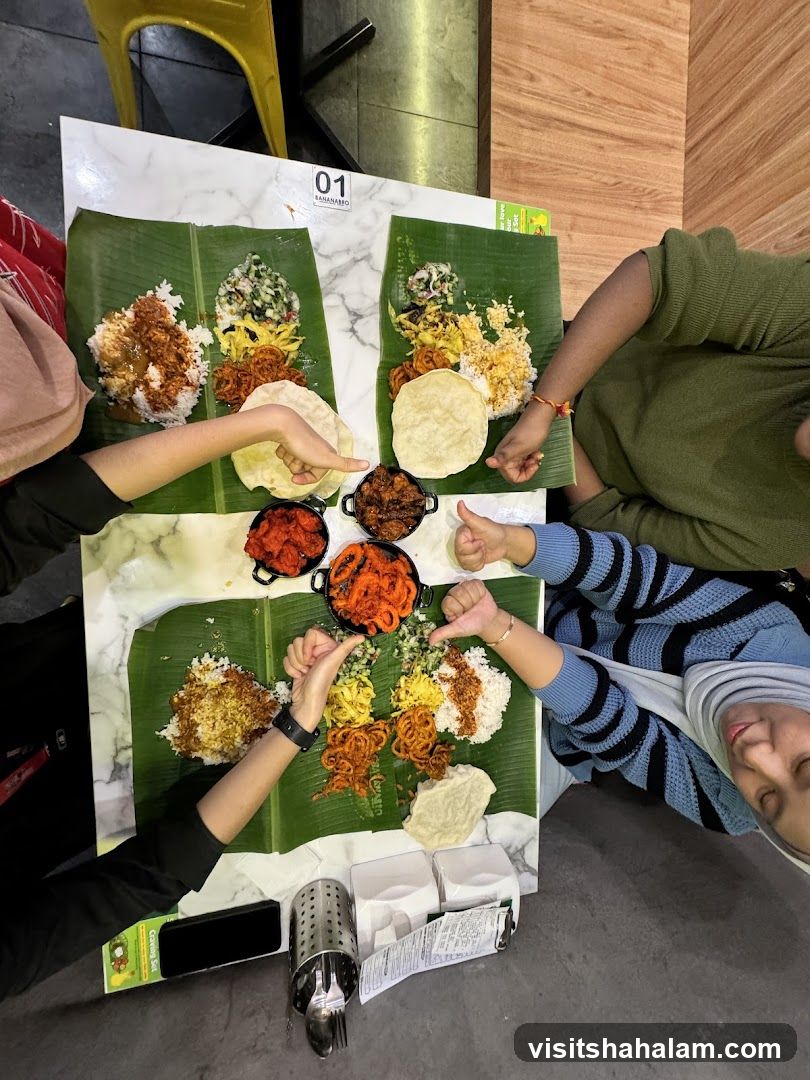 People eating a meal served on banana leaves