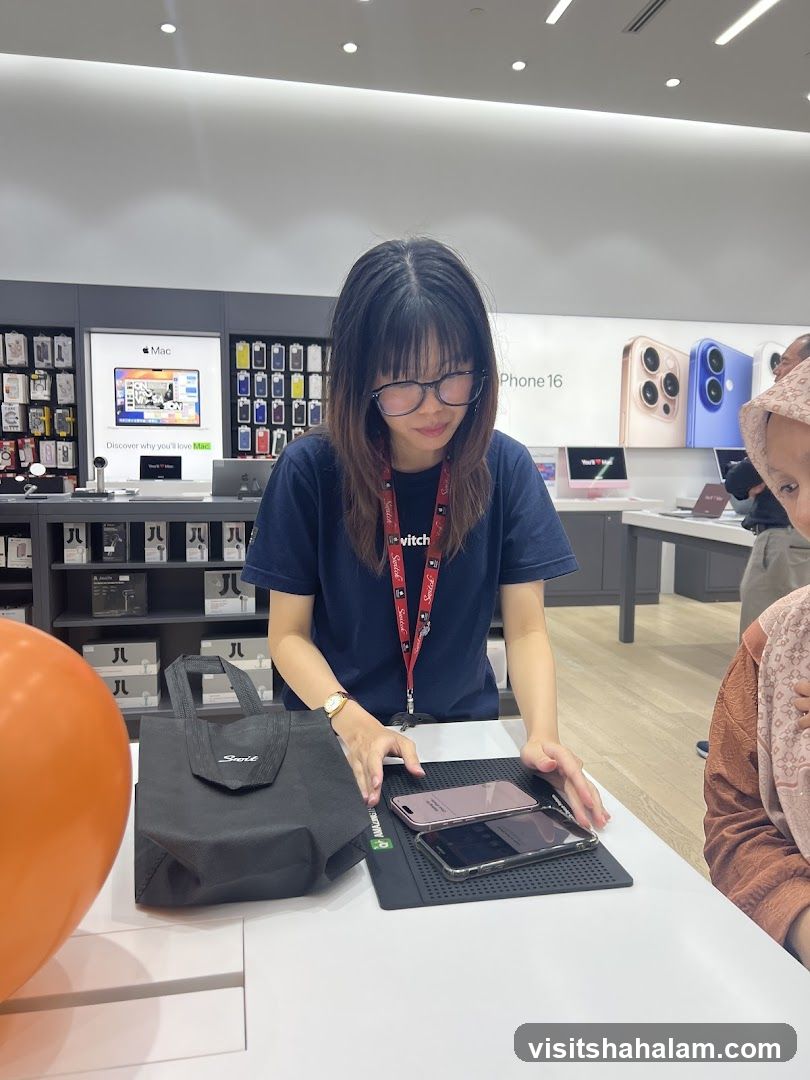 Salesperson showing phones