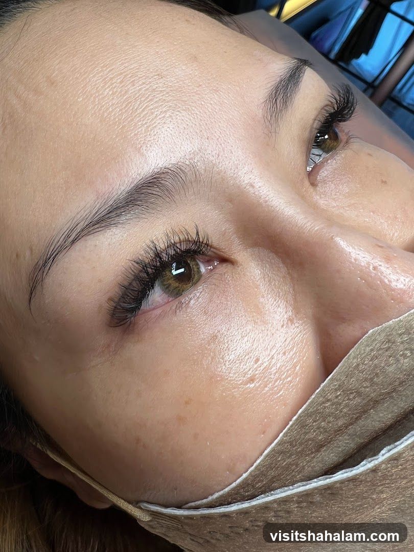 Close-up of a woman's eye with eyelash extensions