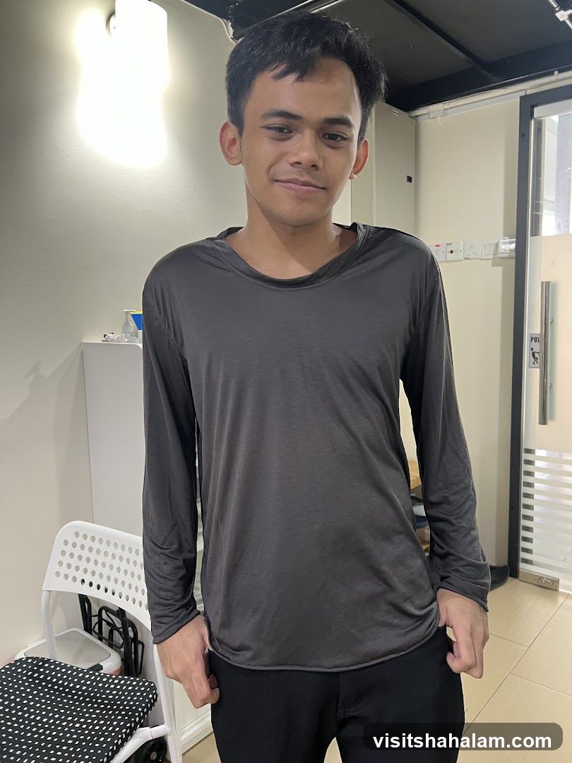 Man in a dark grey long-sleeved shirt