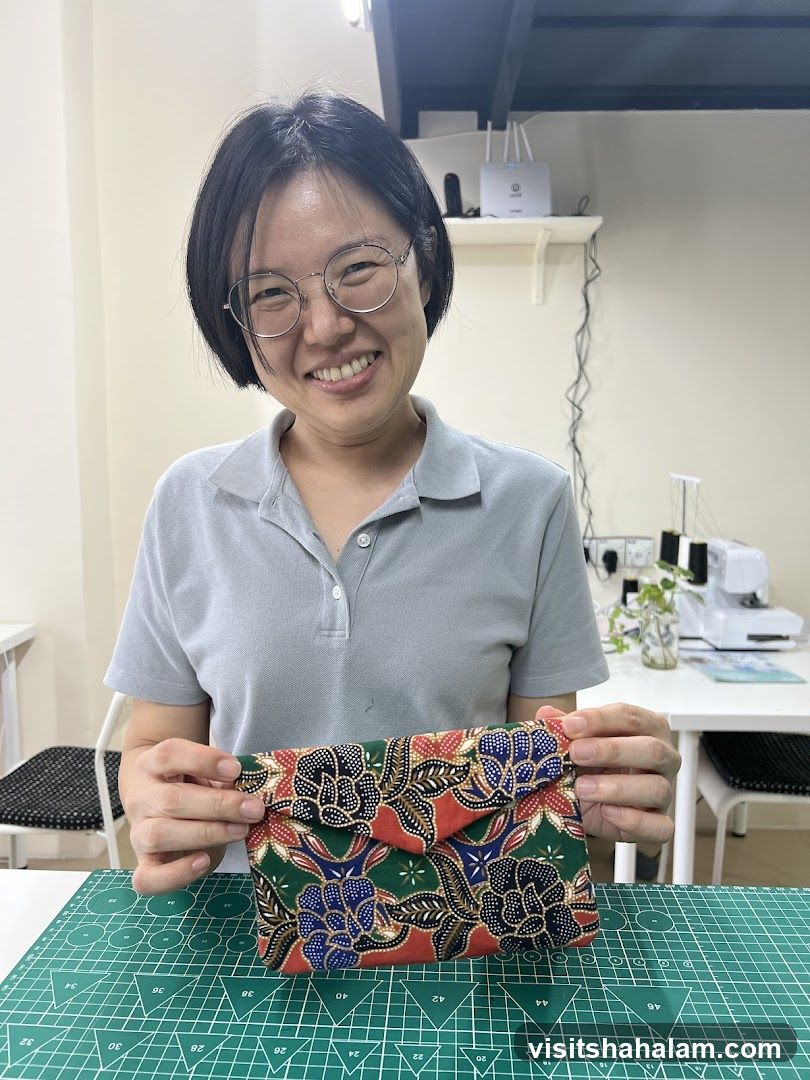 Woman holding a handmade pouch