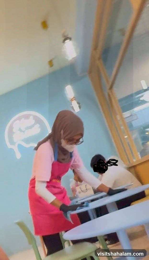 Staff cleaning tables