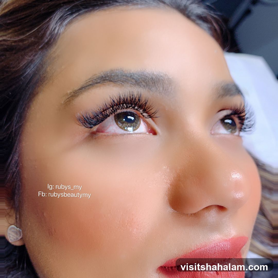 Close-up of a woman's eye with eyelash extensions