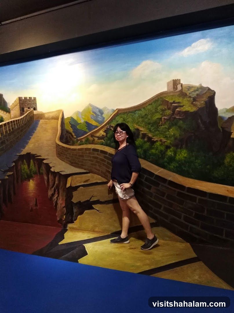 Woman Poses in front of Great Wall of China Mural
