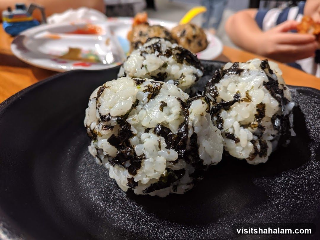 Onigiri on a black plate