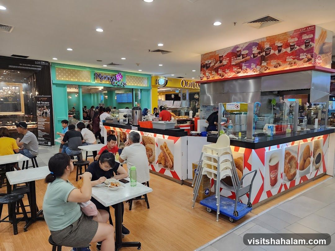 Food court with various stalls and diners