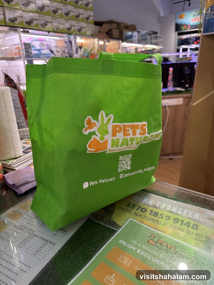 Green tote bag with pet store logo