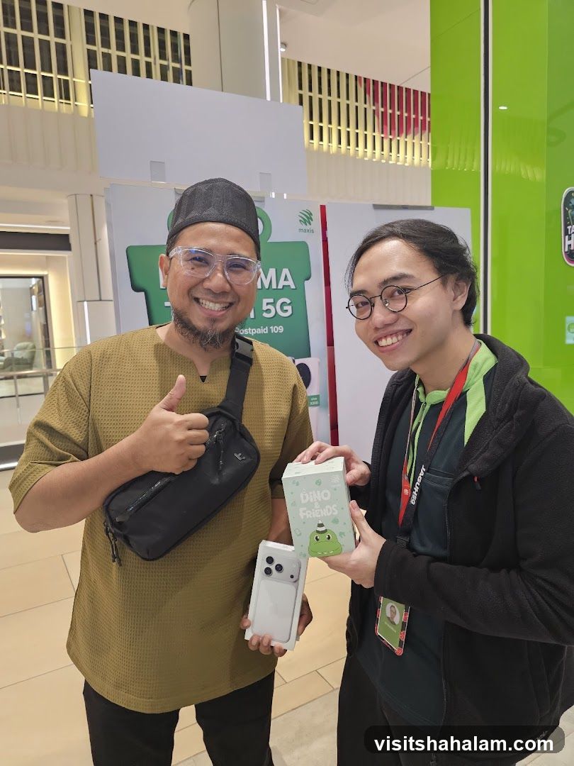 Two men holding a phone and a box
