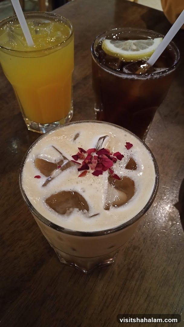 Three Iced Drinks on a Wooden Table
