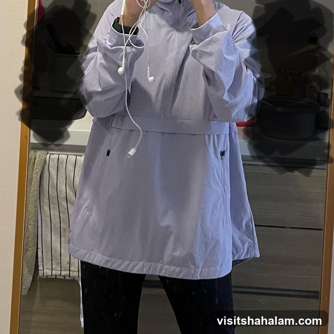 Person wearing a light purple jacket