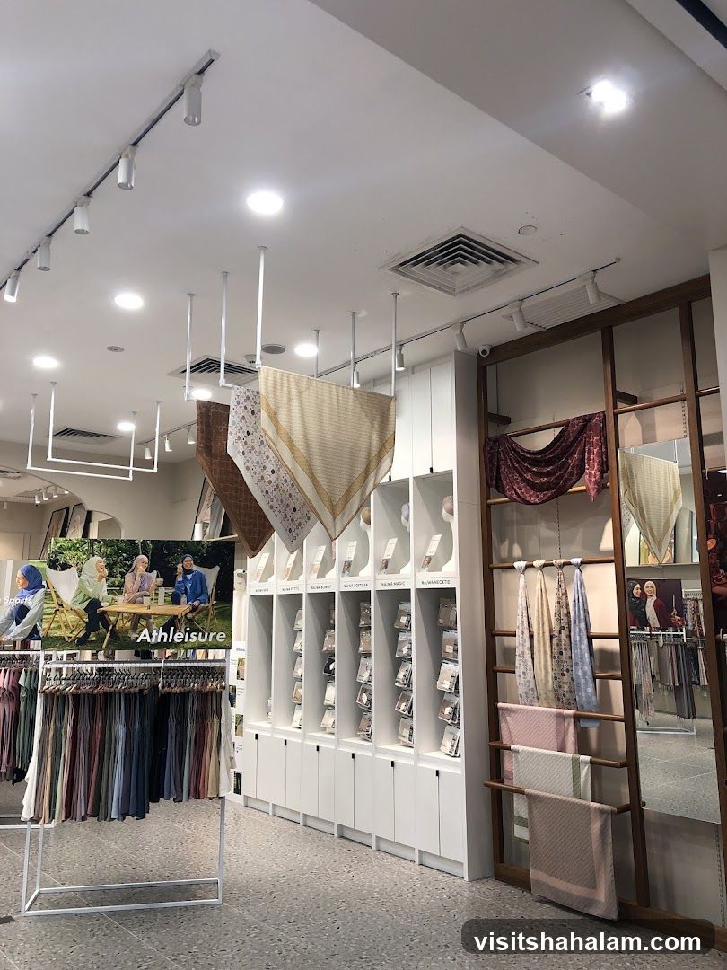Clothing store interior with scarves and apparel