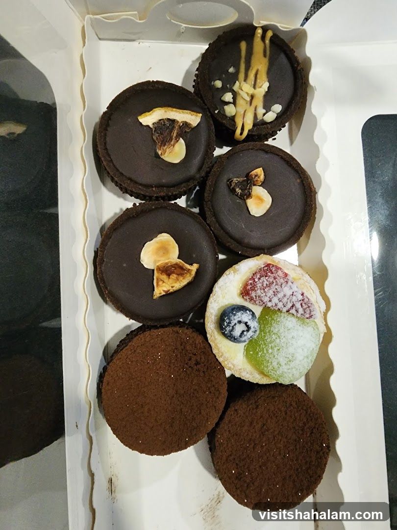Assortment of Chocolate Tarts and Fruit Tart