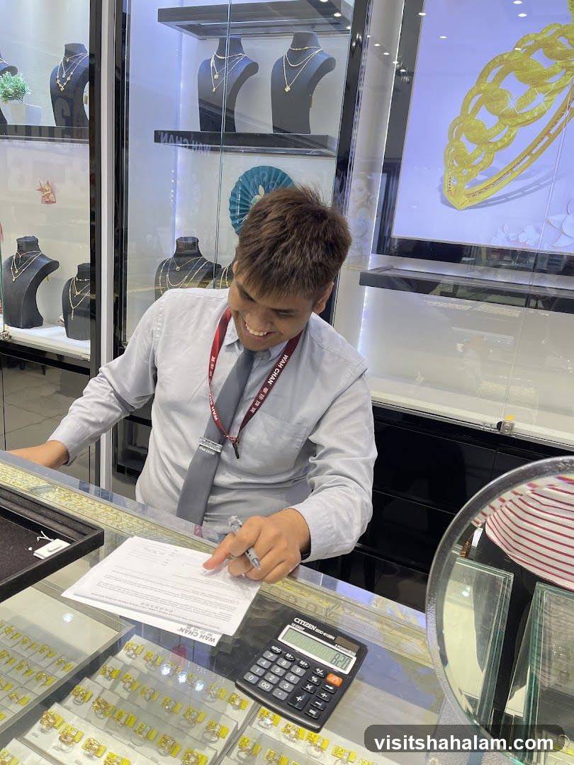 Jewelry store employee signing paperwork
