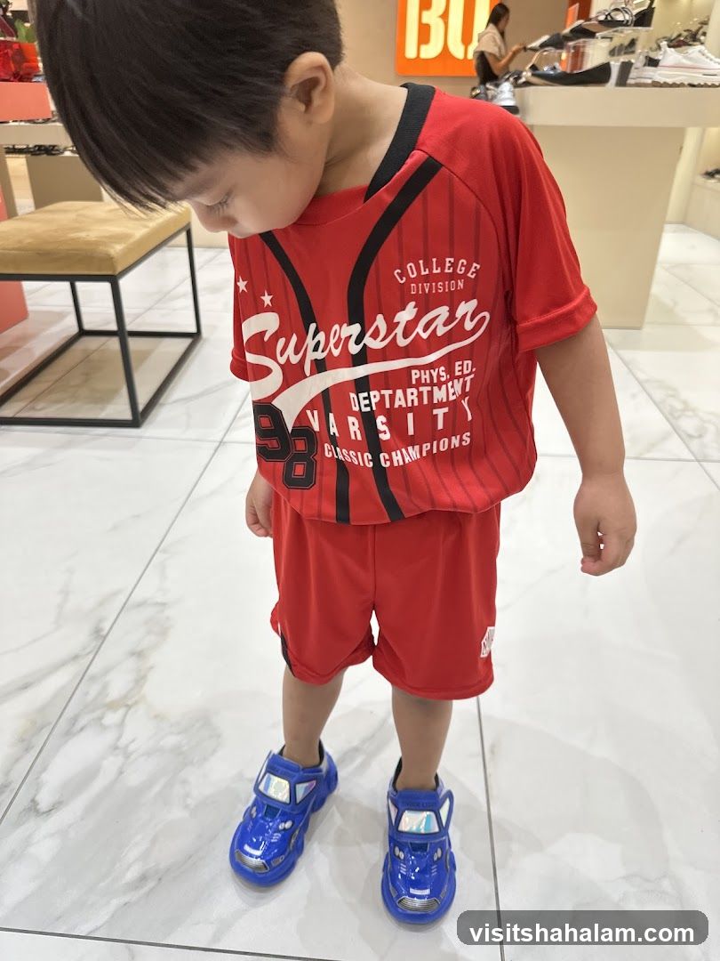 Boy in Red Athletic Outfit and Blue Car Shoes