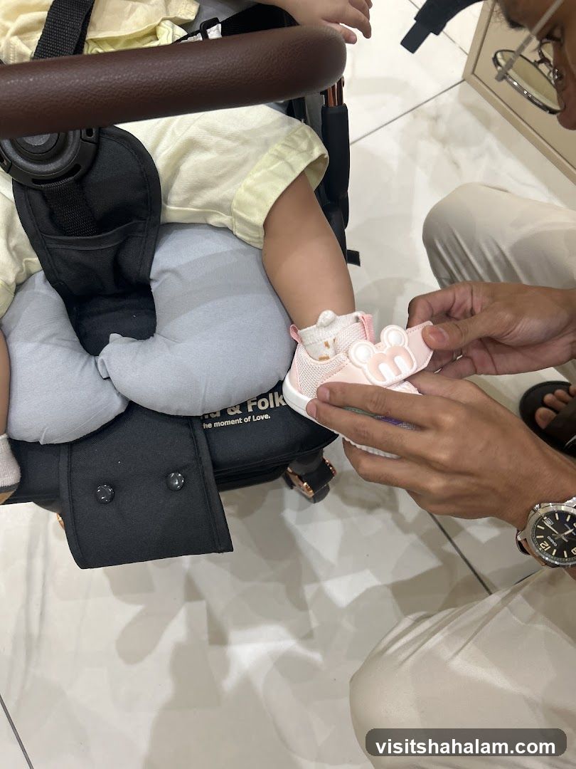 Putting on a baby shoe