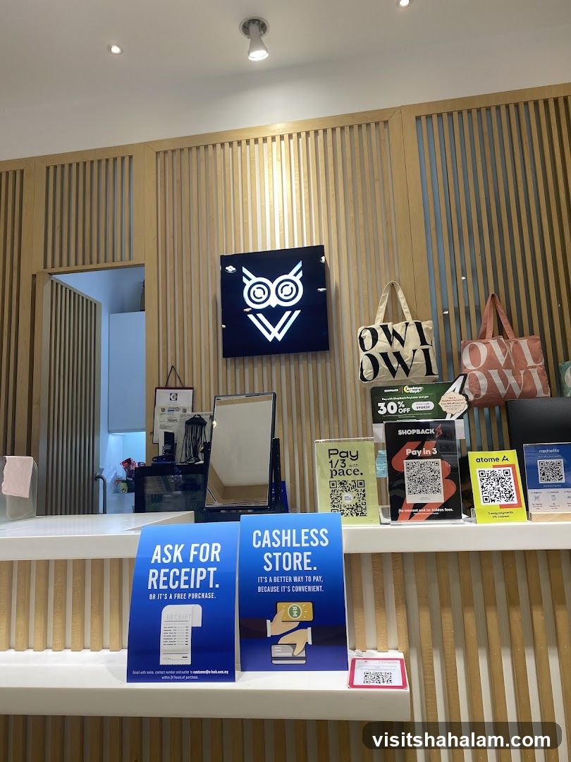 Store Counter with Owl Logo and Payment Options