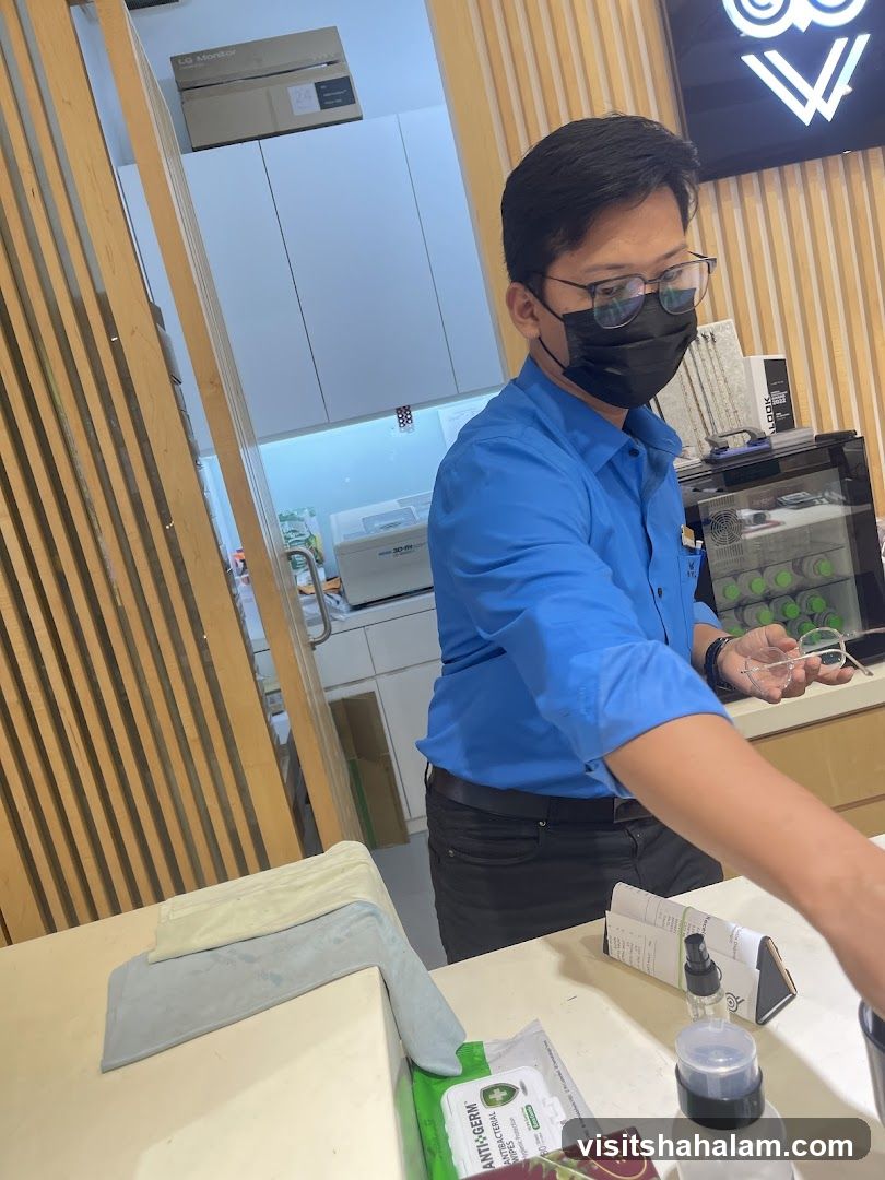 Optician assisting customer