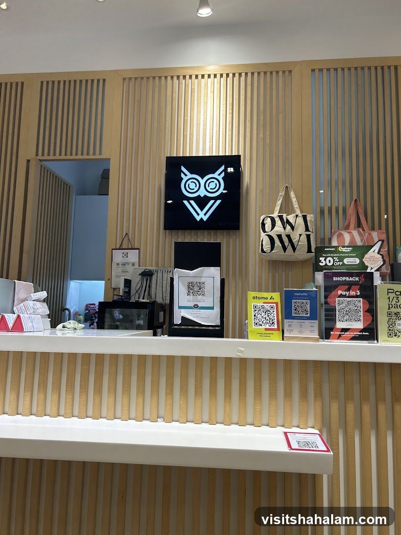 Counter with Owl Logo and Payment Options