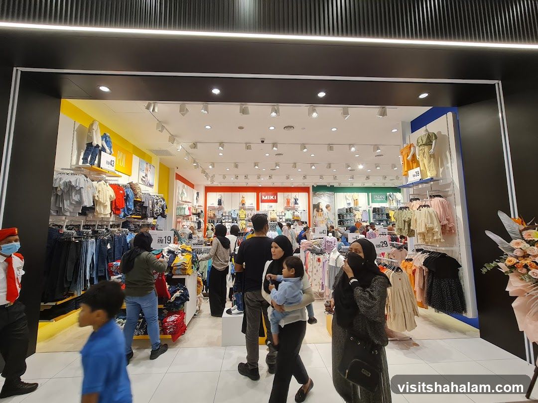 Clothing store interior with shoppers