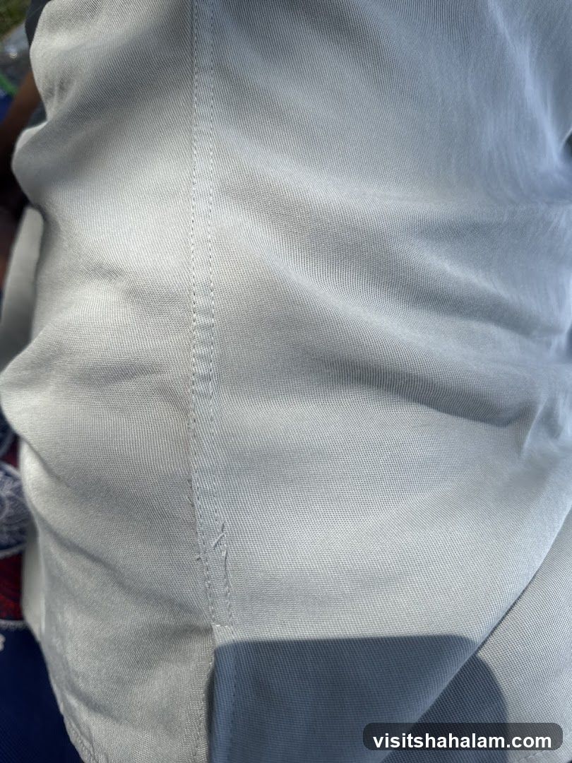Close-up of light-colored fabric with stitching